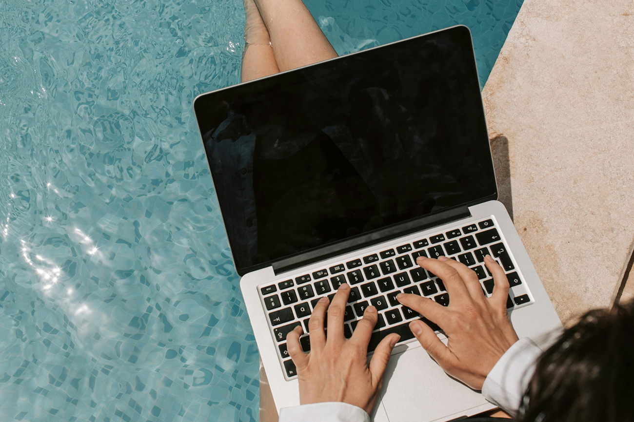 person typing on laptop